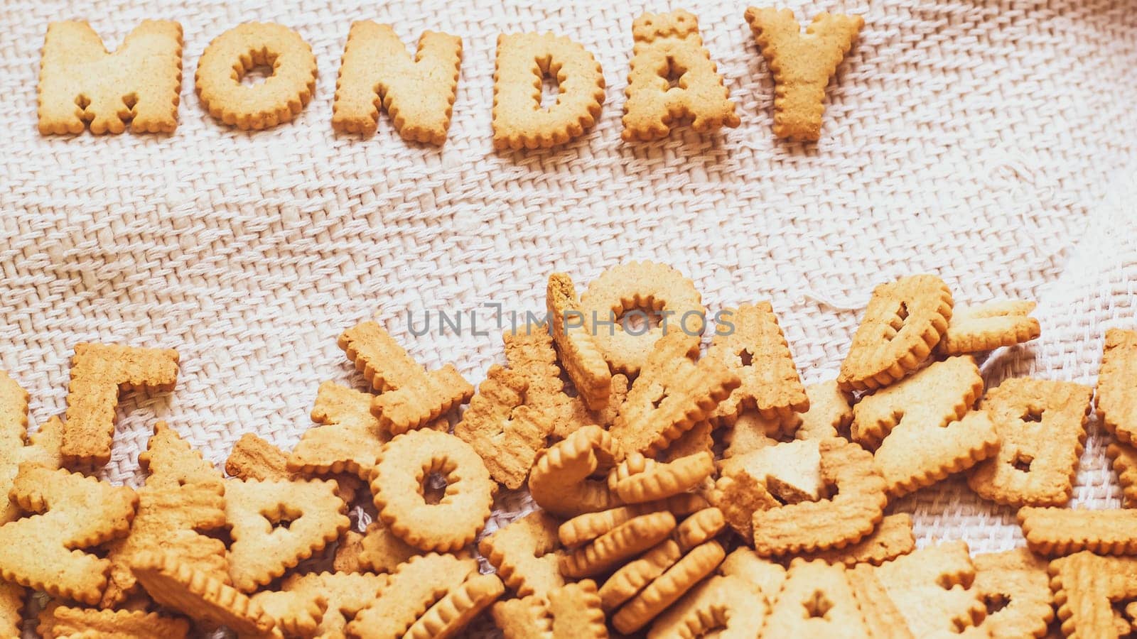 Cookies in the form of the alphabet prospect .Happy from homemade cookies on dark white background. Happy cookies concept.