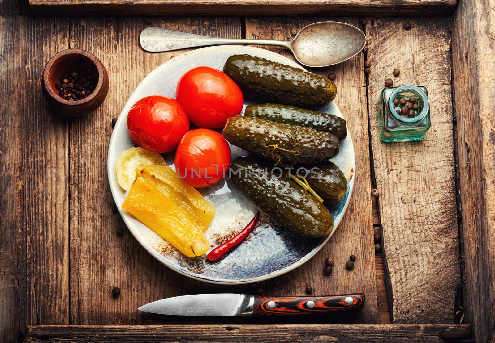 Homemade pickled cucumbers and tomatoes, homemade pickles. White background