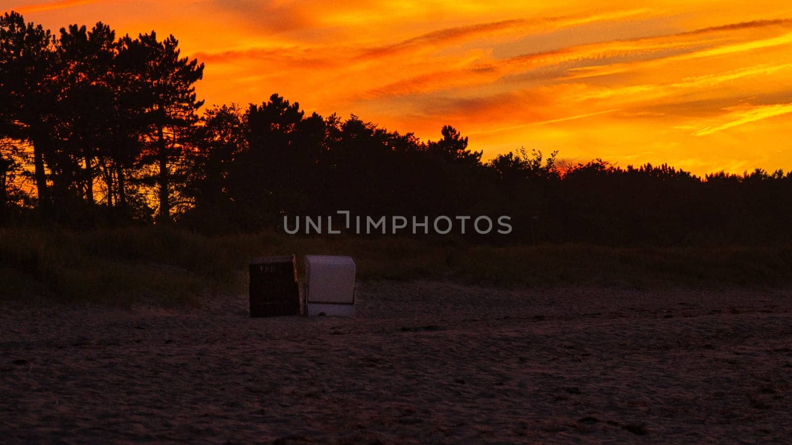 sunset on the beach of the baltic sea in zingst. warm light atmosphere. resort