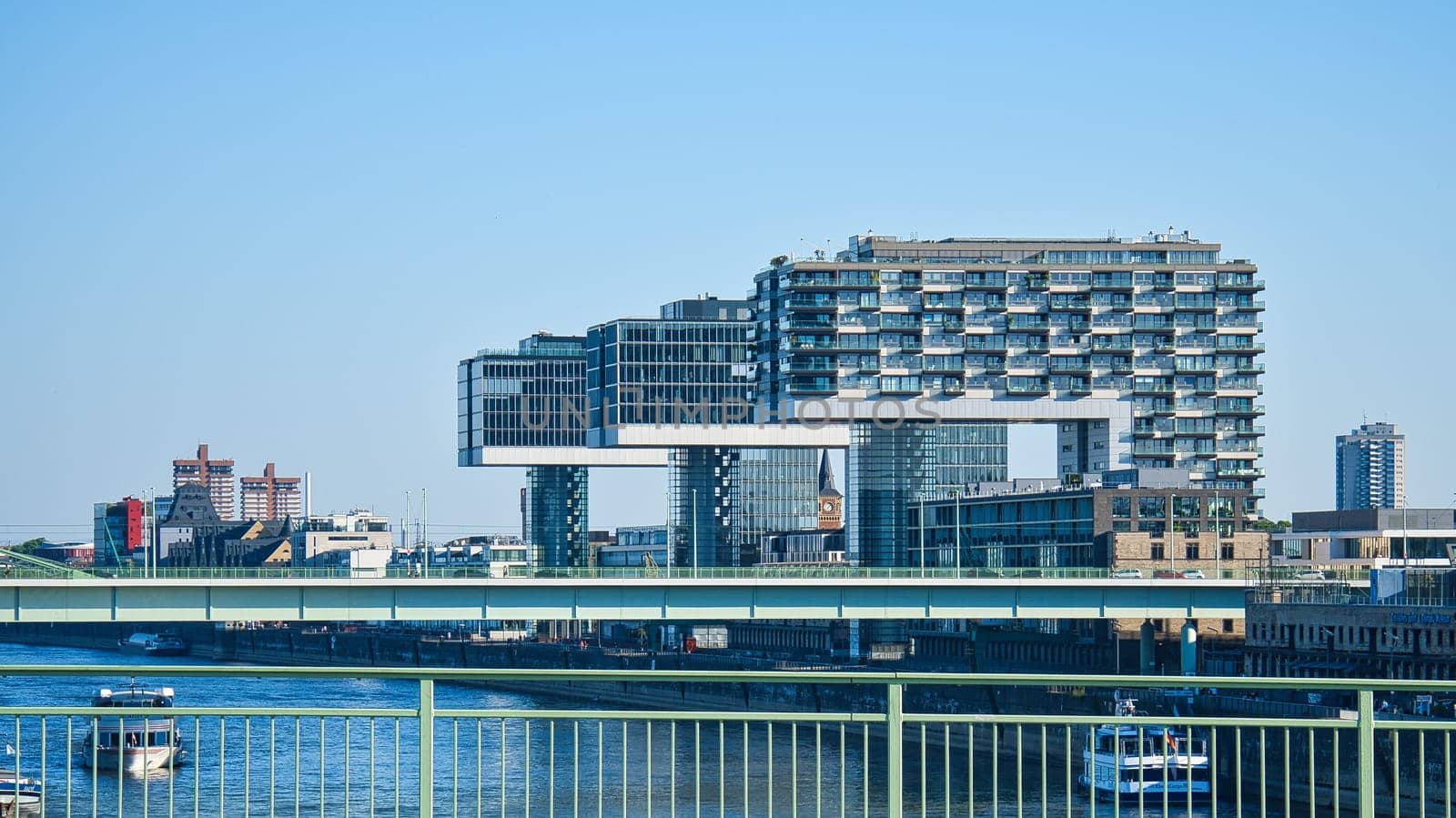 Crane house in cologne, germany. Modern architecture at the port of the river Rhine. In the background the center of the city center. Architecture shot from big city Cologne.