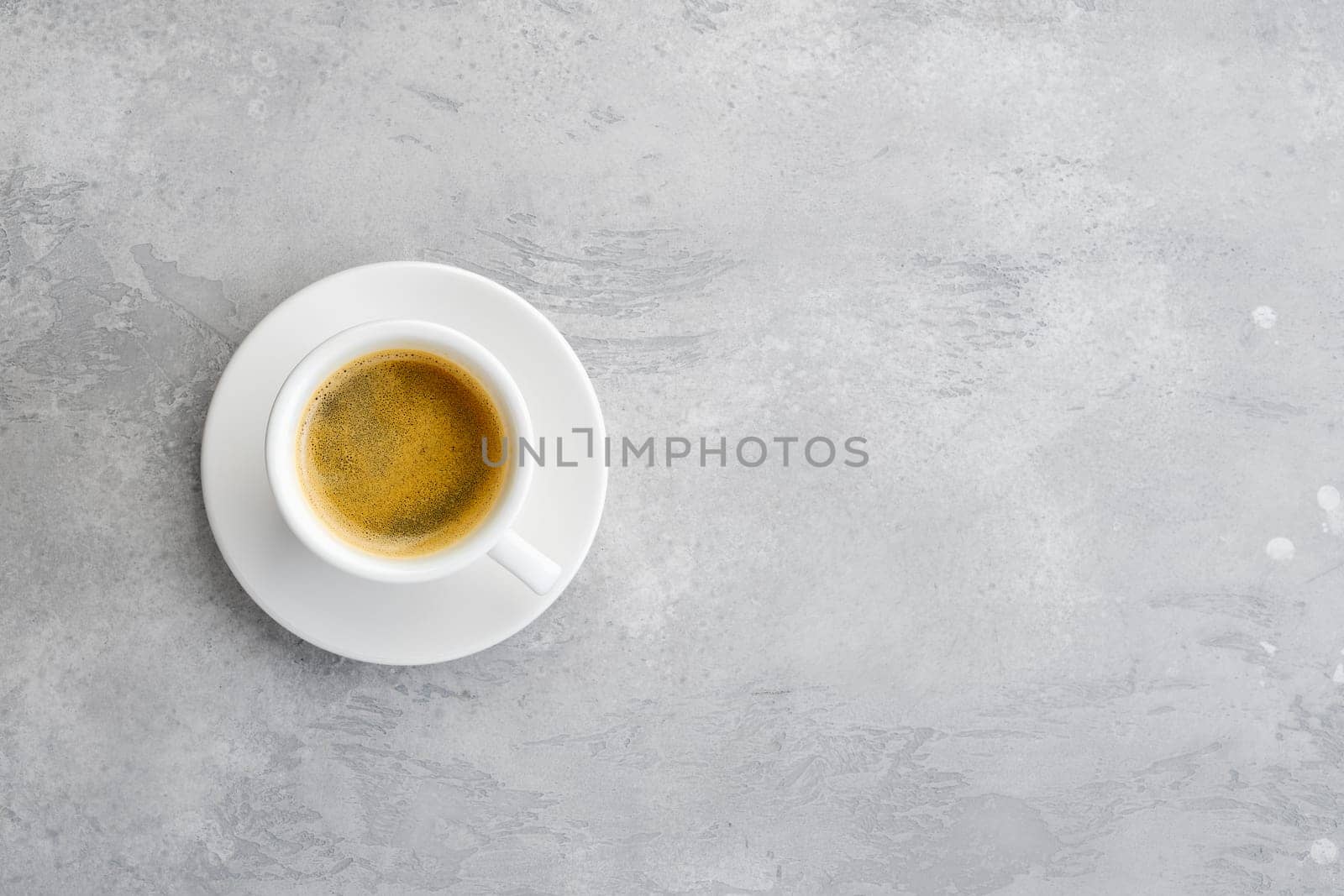 Overhead view of porcelain cup of strong coffee