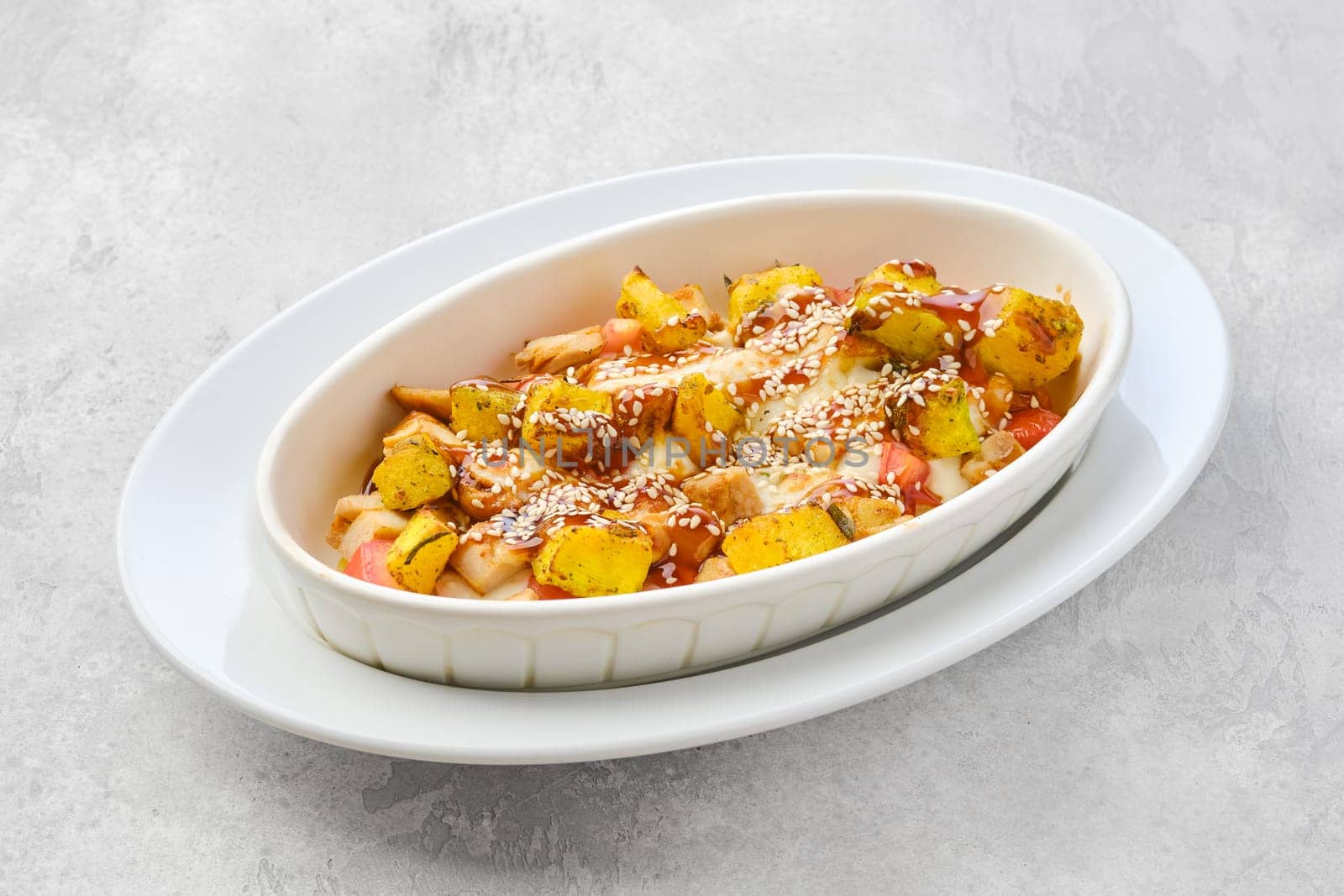 Hot casserole with chicken, pumpkin, bell pepper and potatoes