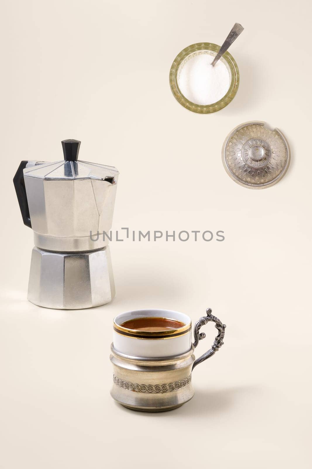 Coffee concept - cup of coffee, geyser coffee maker and shugar