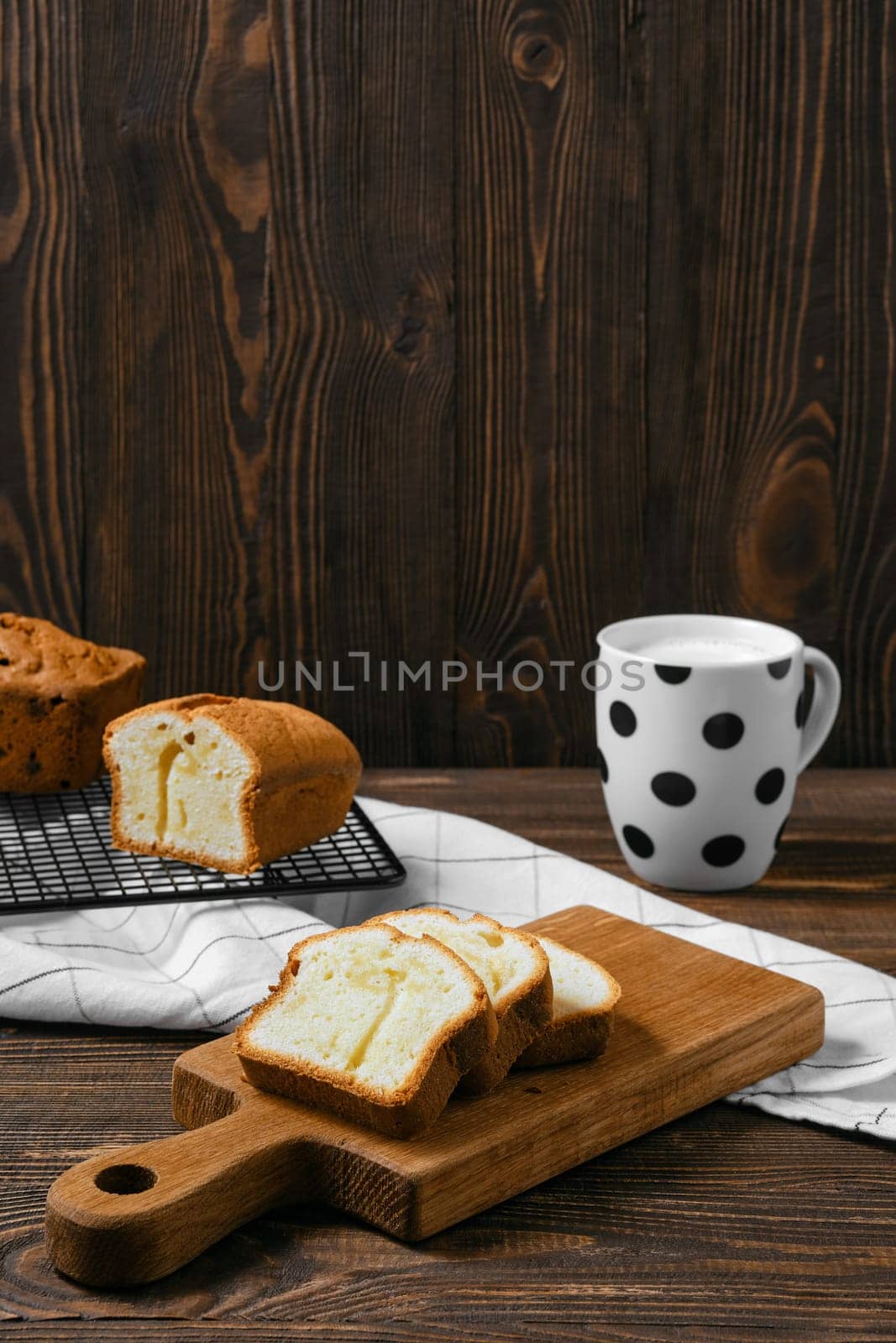 Fresh biscuit cake with apple on wooden table