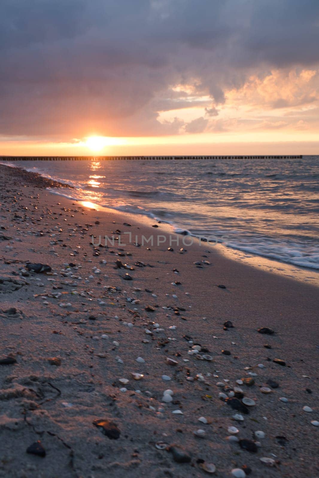 Sunset on the Baltic Sea. Sea, bean strong colors. Vacation on the beach. Romantic mood on the darss. Landscape photo.