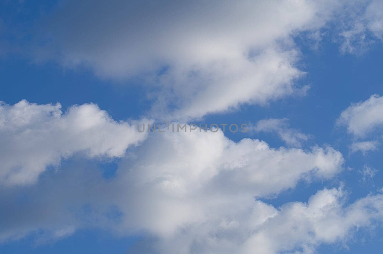 Clouds illuminated by the sun in the sky as background. Background image for further editing