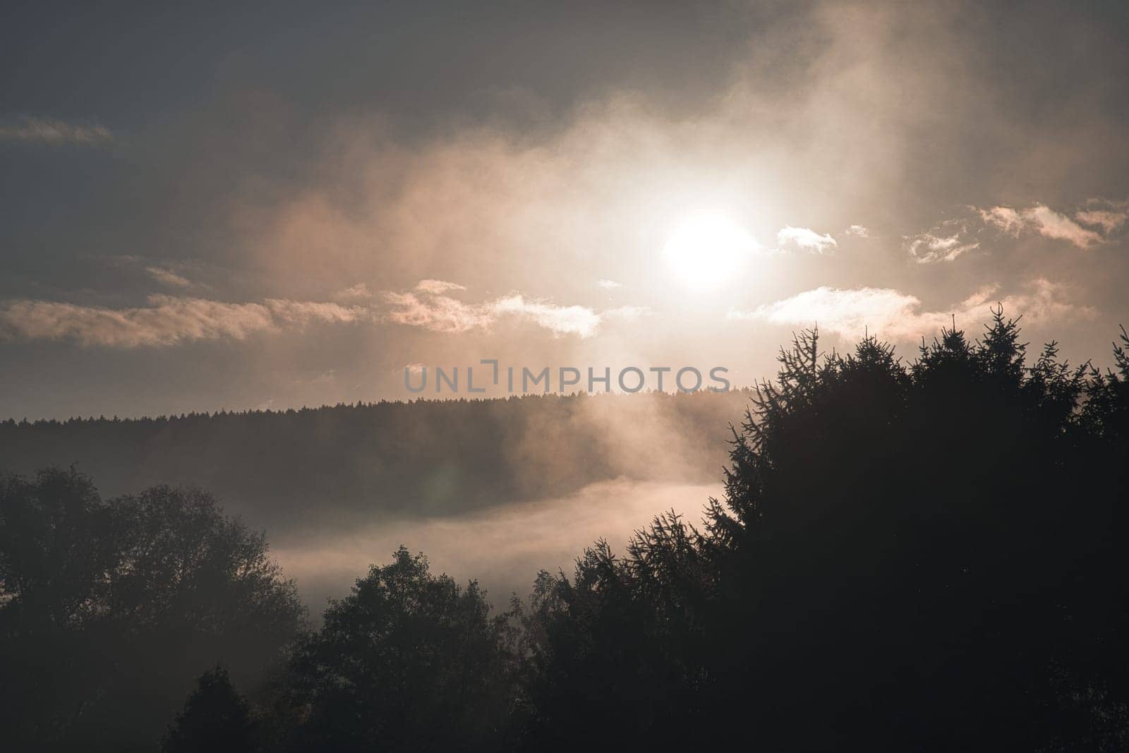 sunrise with fog in the early morning hours. mystical atmosphere. Taken in Saarland in beautiful landscape