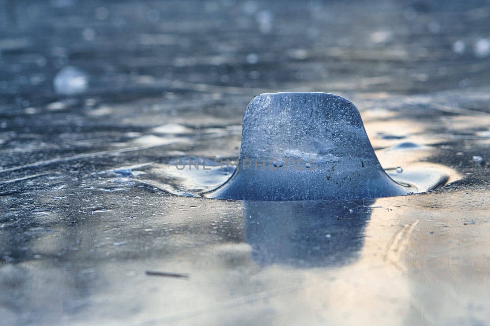 Ice pieces on a lake at sunset in winter atmosphere. cold season