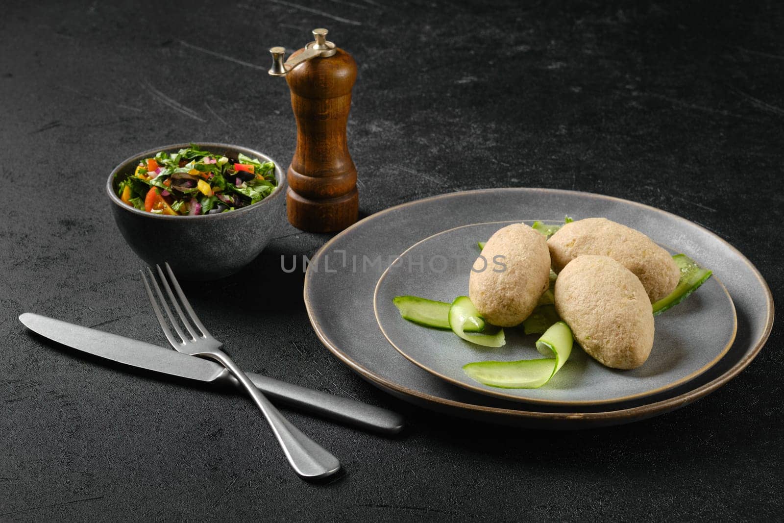 Semifinished frozen cepelinai. Potato dumplings stuffed with ground meat.