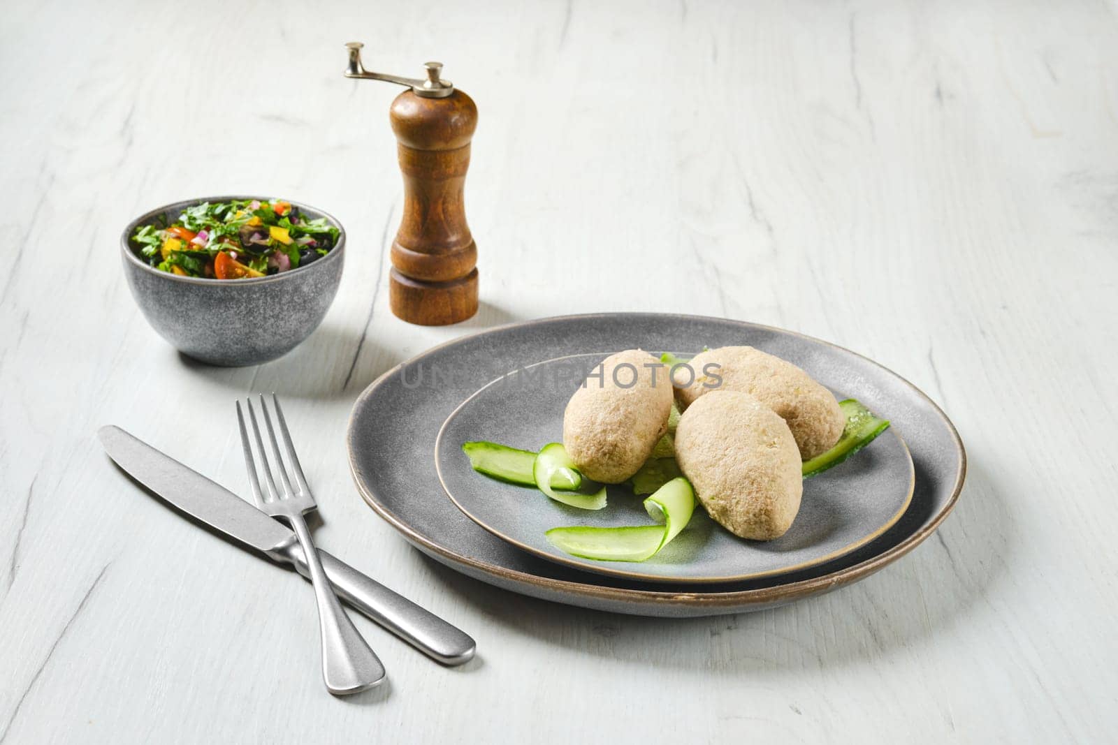 Semifinished frozen cepelinai. Potato dumplings stuffed with ground meat.