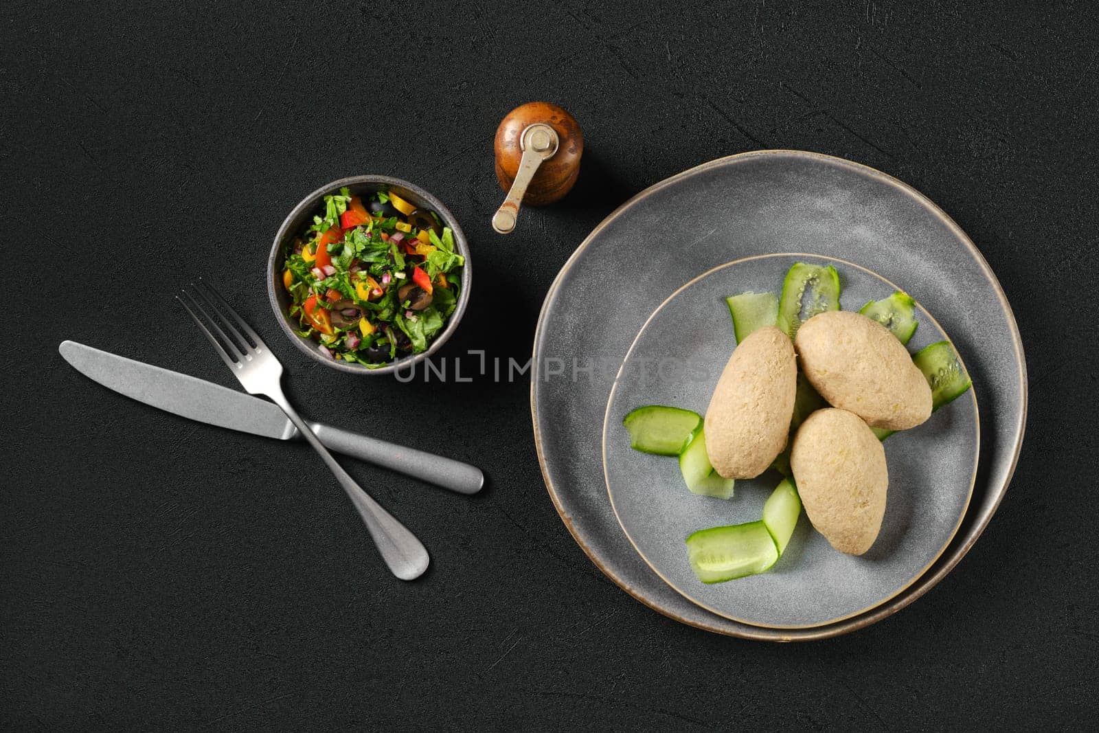 Top view of semifinished frozen cepelinai. Potato dumplings stuffed with ground meat.