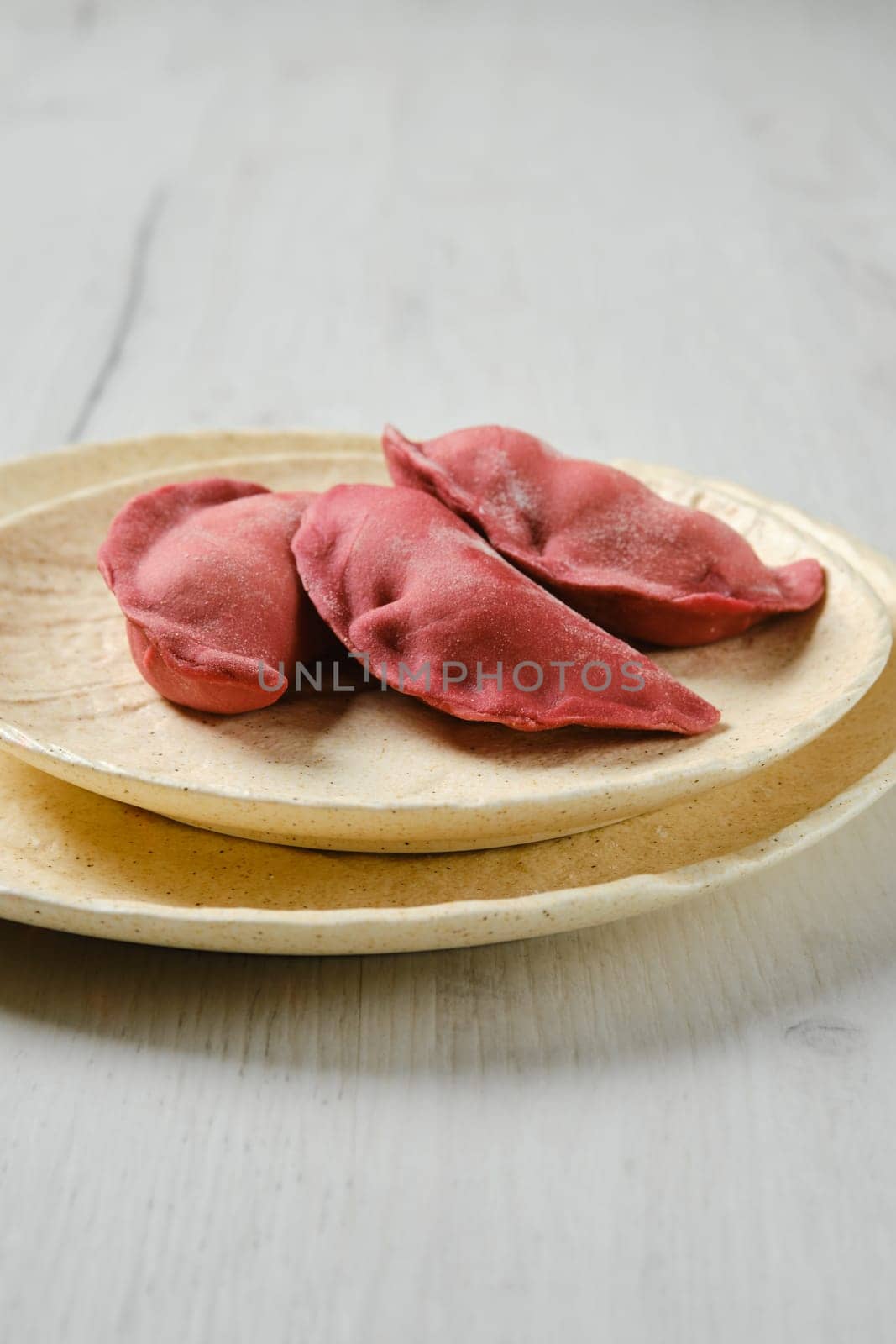 Concept of delivery of semifinished food. Sweet dumplings stuffed with cherry and frozen.