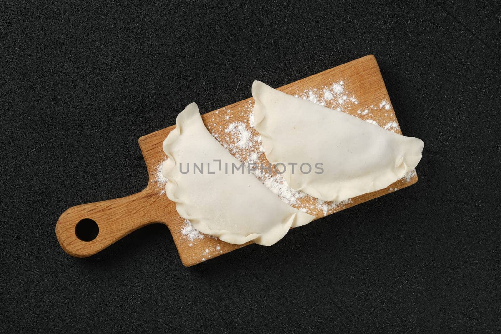 Top view of cheburek - a pie made of thin unleavened dough stuffed with lamb and hot spices