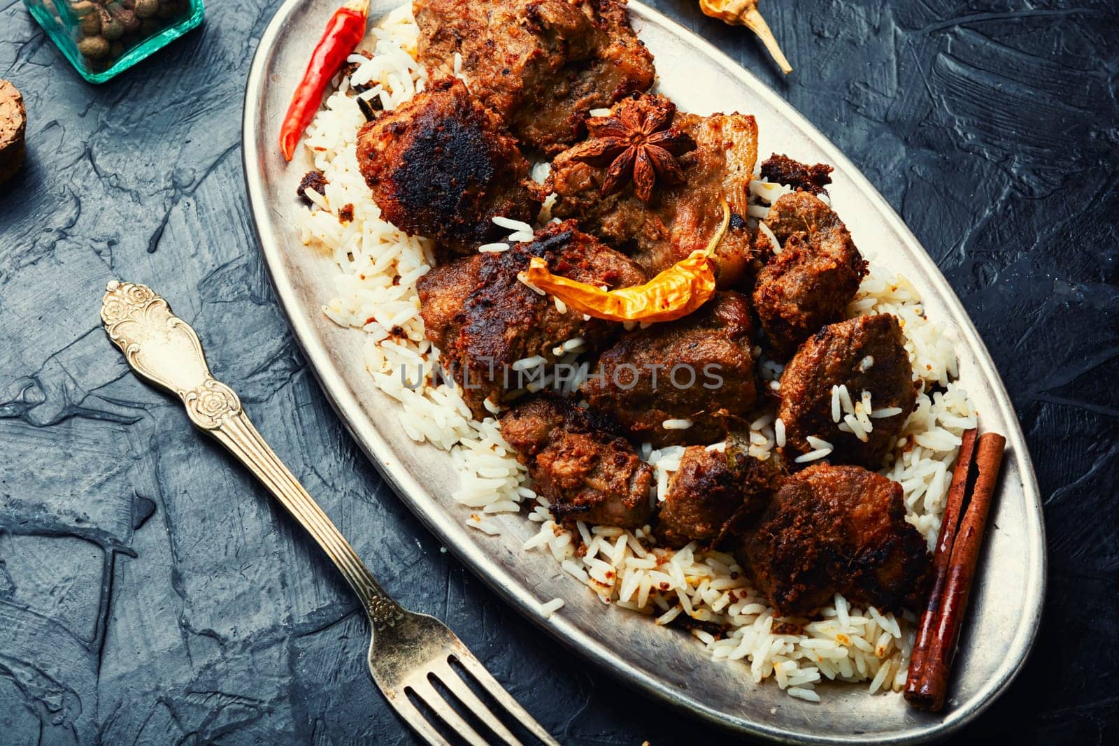 Vinegar marinated pork stewed in Indian spices, vindaloo.