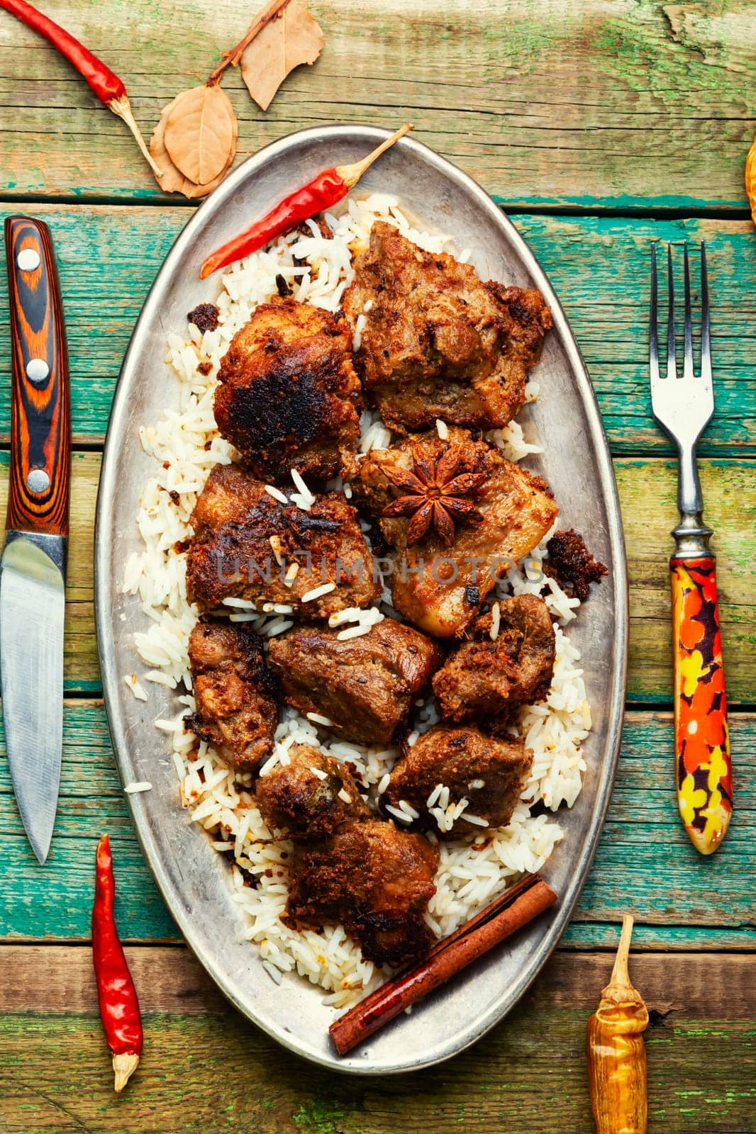 Vinegar marinated pork stewed in Indian spices, vindaloo.