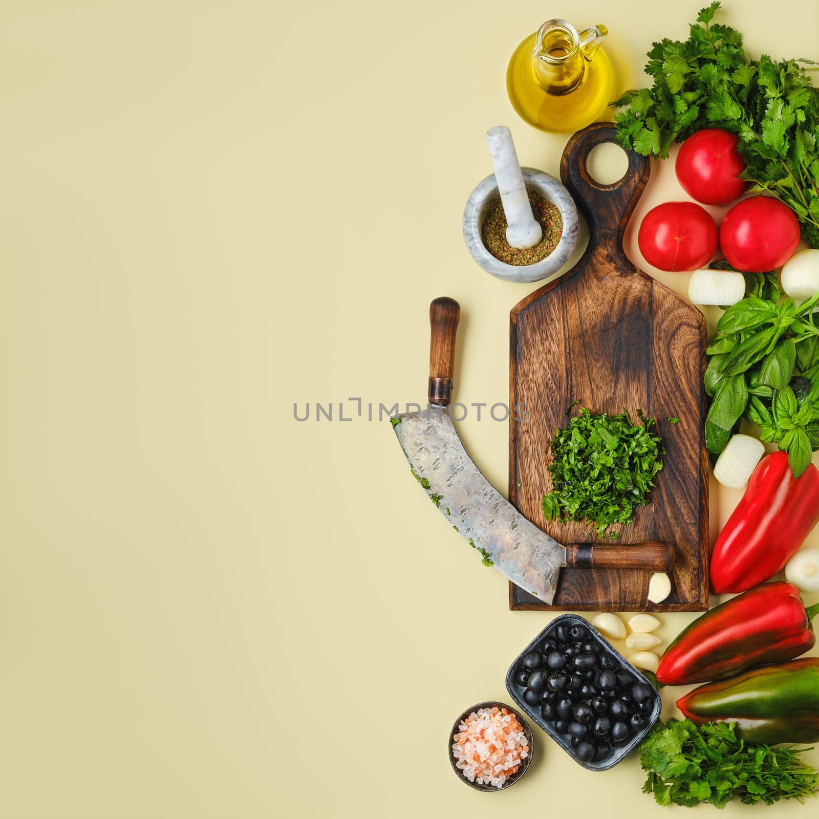Top view of mezzaluna and ffresh vegetables. World vegan food day concept.