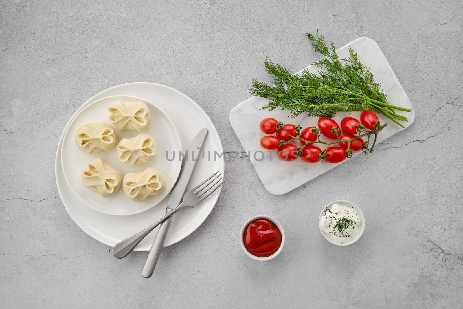 Top view of frozen semifinished manti stuffed with lamb meat