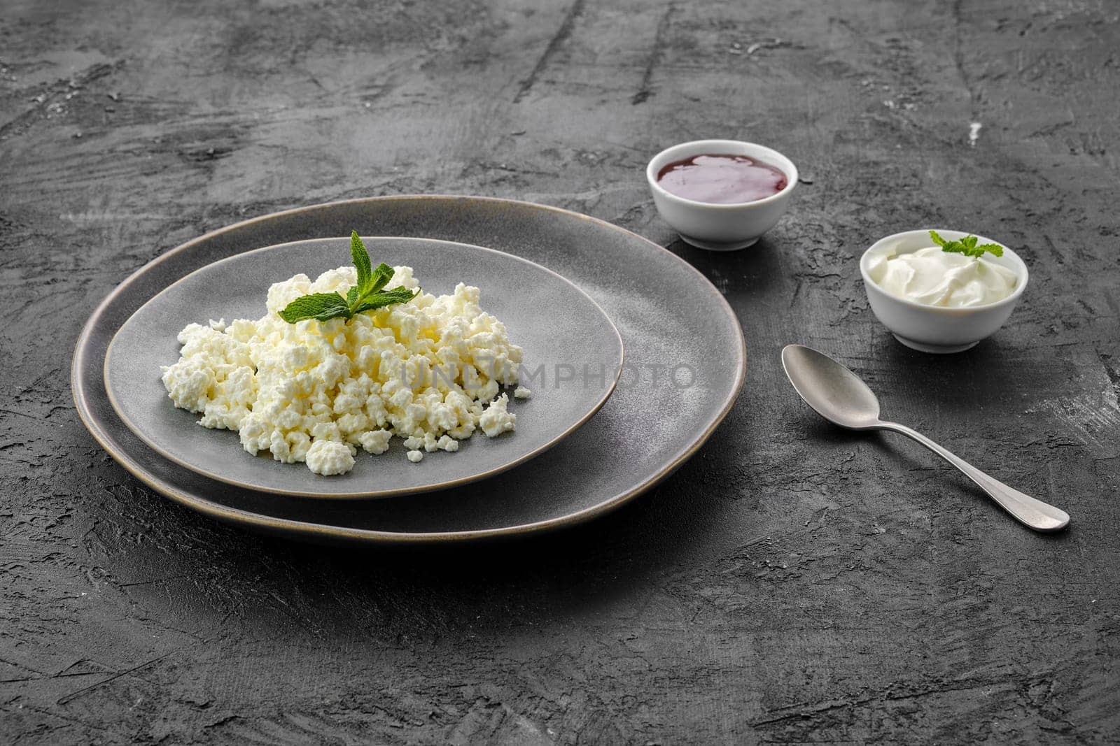 Fresh homemade cottage cheese on a plate