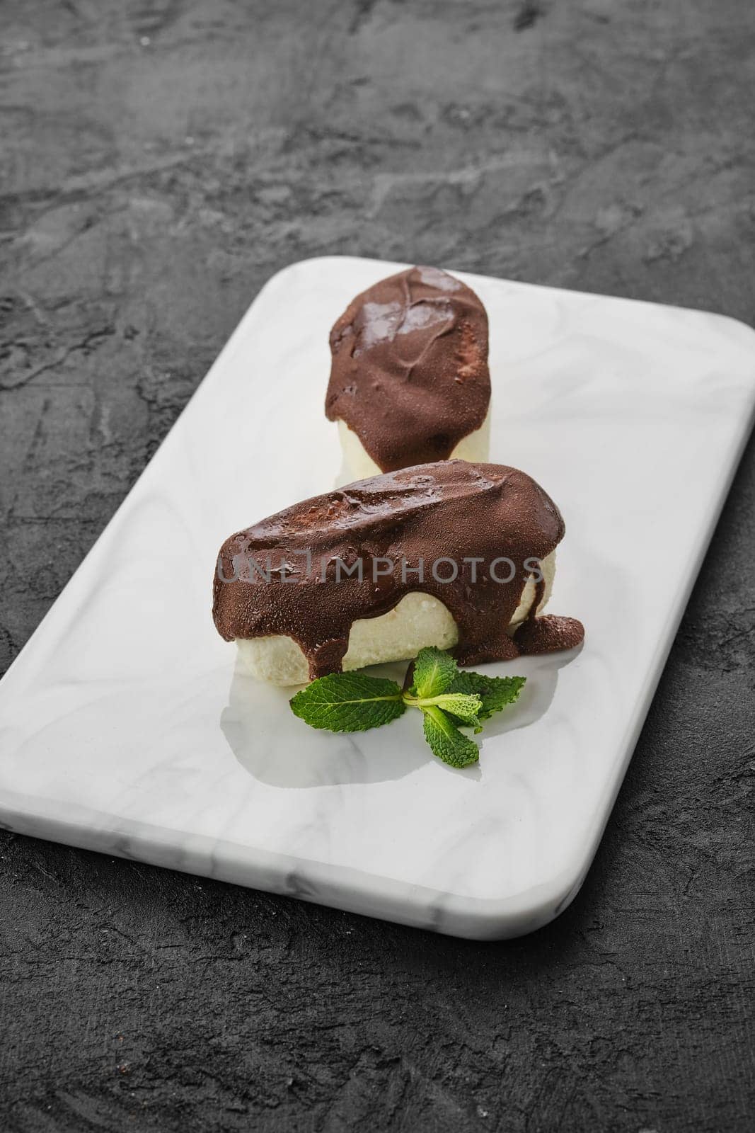 glazed curd with chocolate  on marble plate