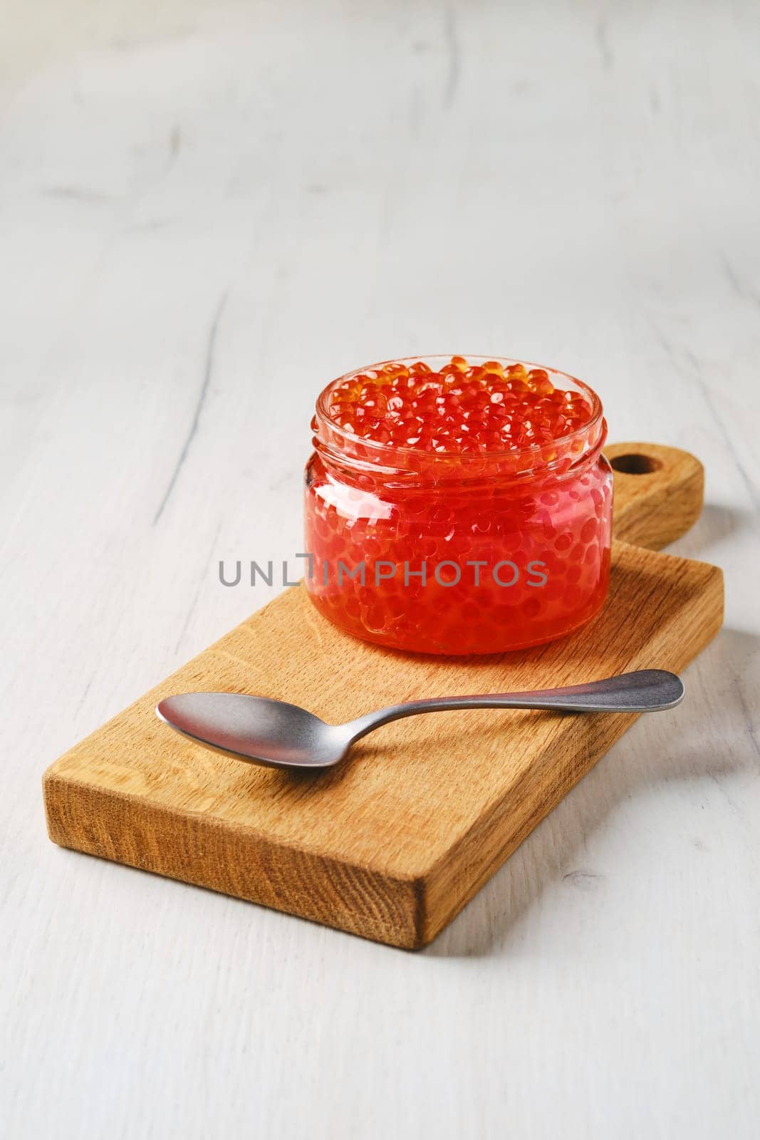 Open bowl with pink salmon red caviar