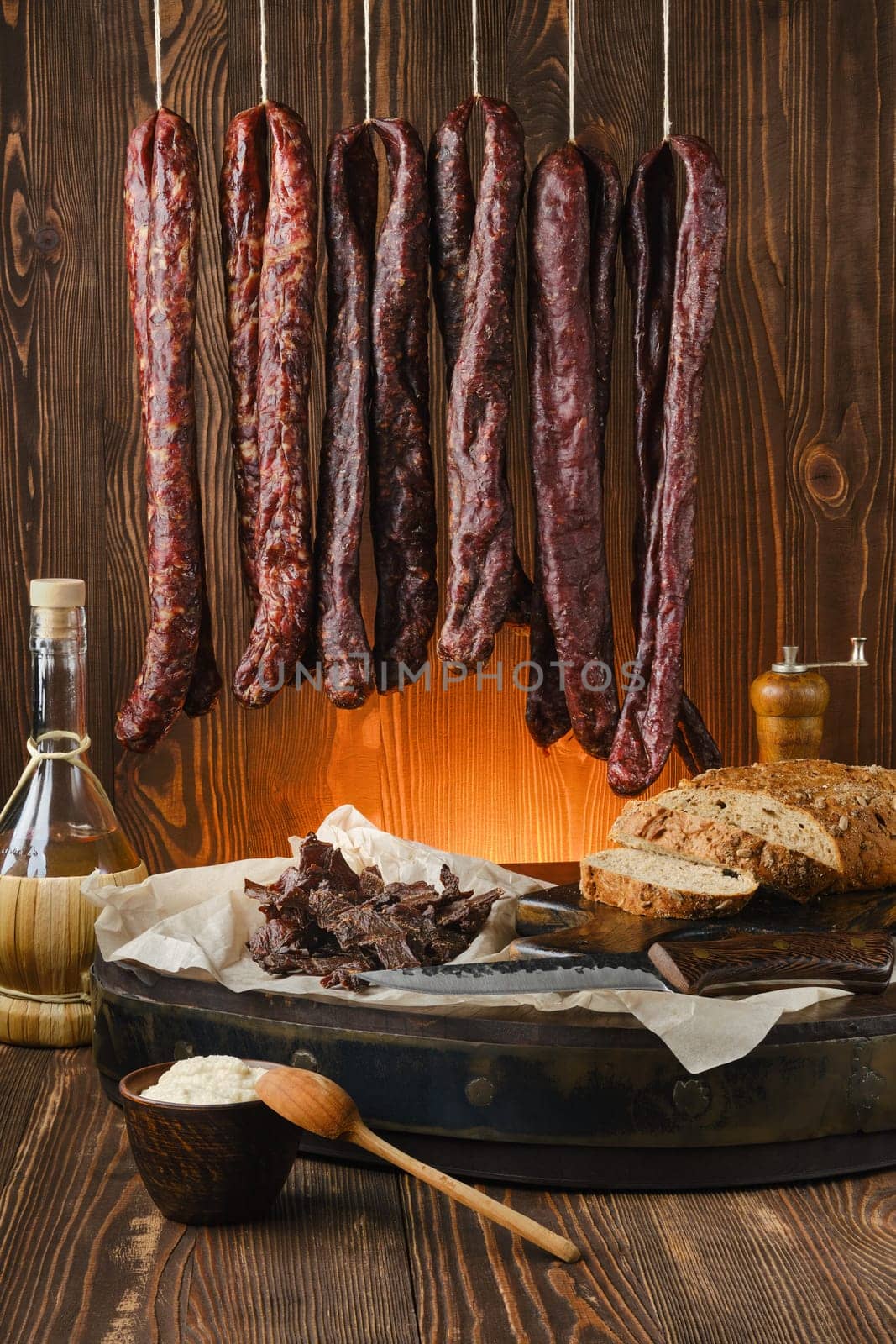Assortment of dried venison sausages on the rope and jerky venison