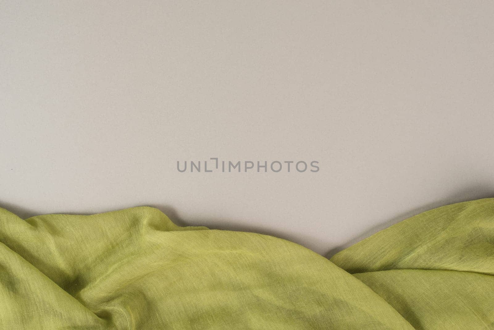 Background with a green colored woven cloth, copy space for text