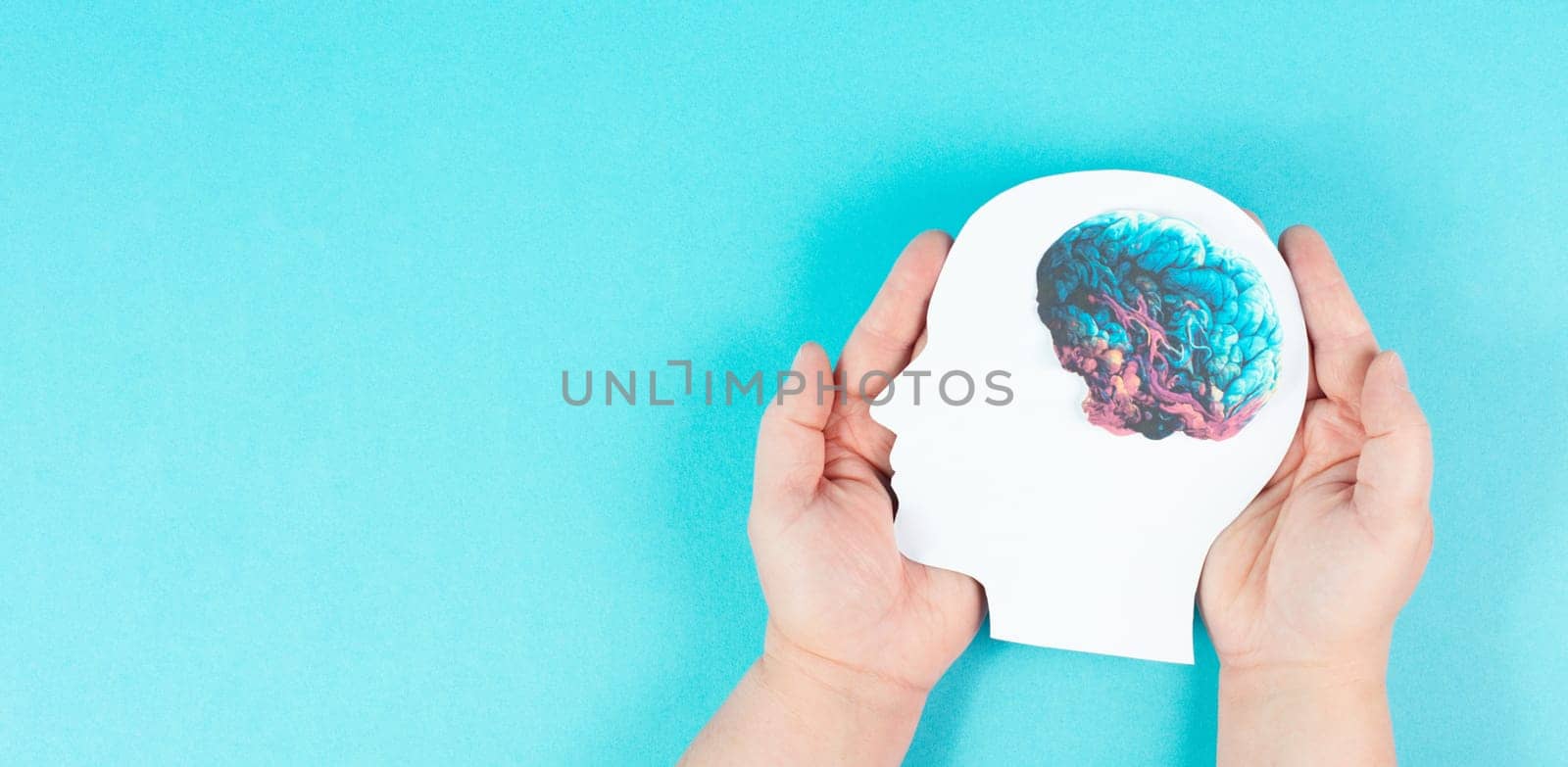 Holding a head with a brain in the hands, Parkinson disease, Alzheimer awardness, mental disorder dementia, psychology problems, cerebral vein thrombosis