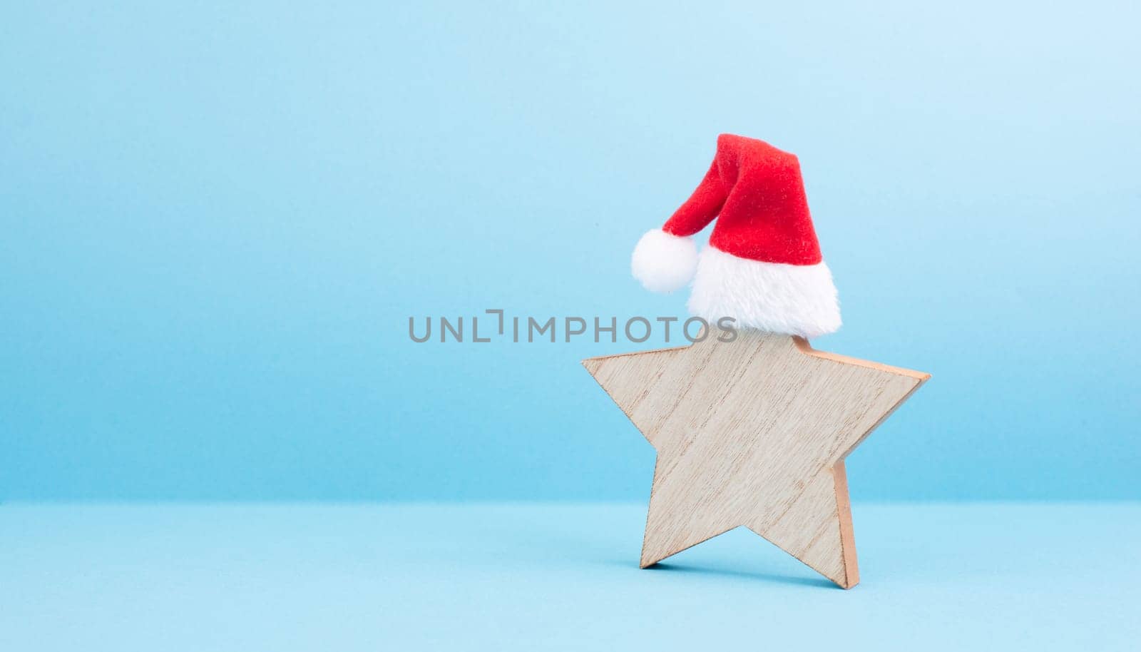 Star with a red christmas hat, winter greeting card and banner, copy space