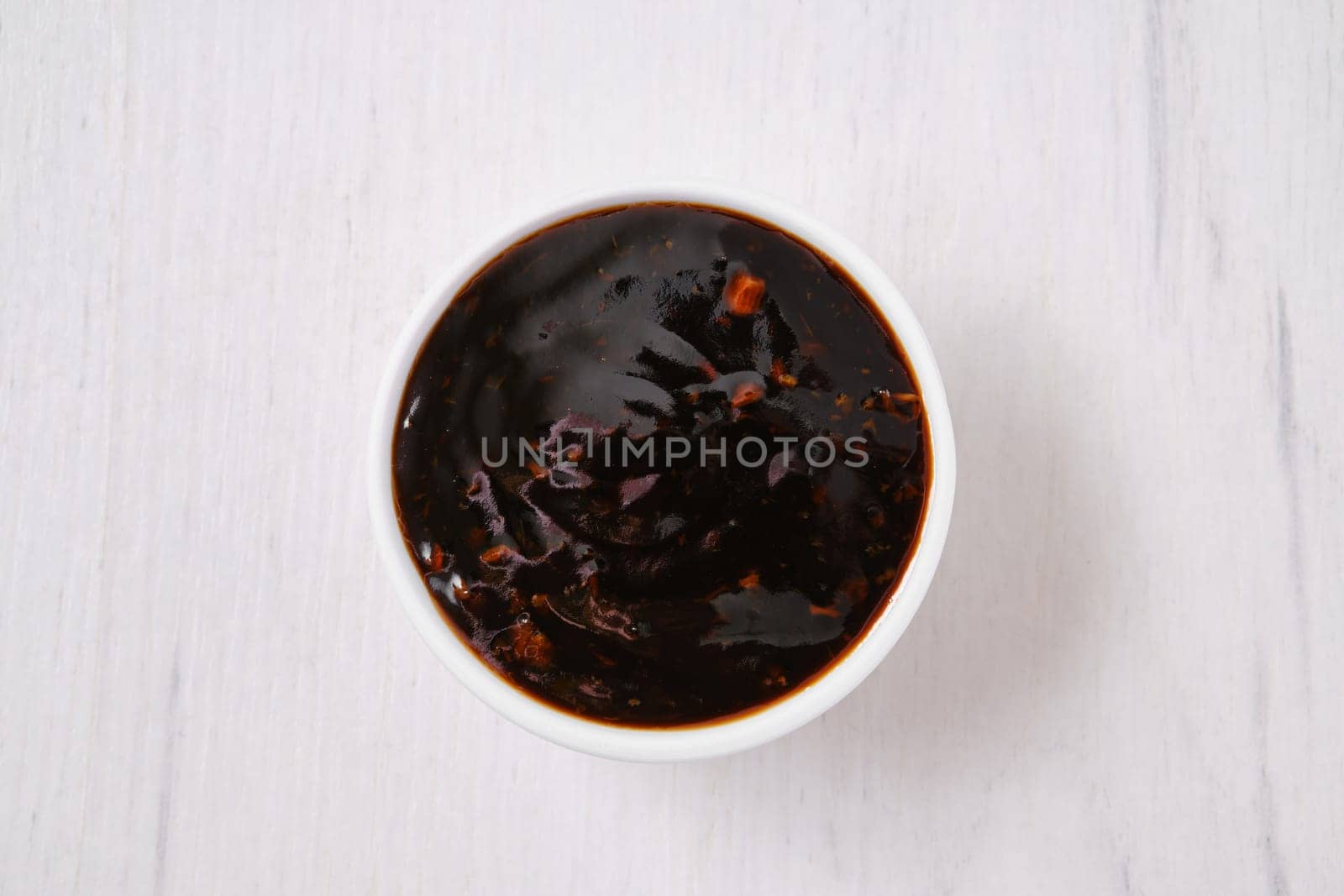 Overhead view of small bowl with spicy teriyaki sauce.