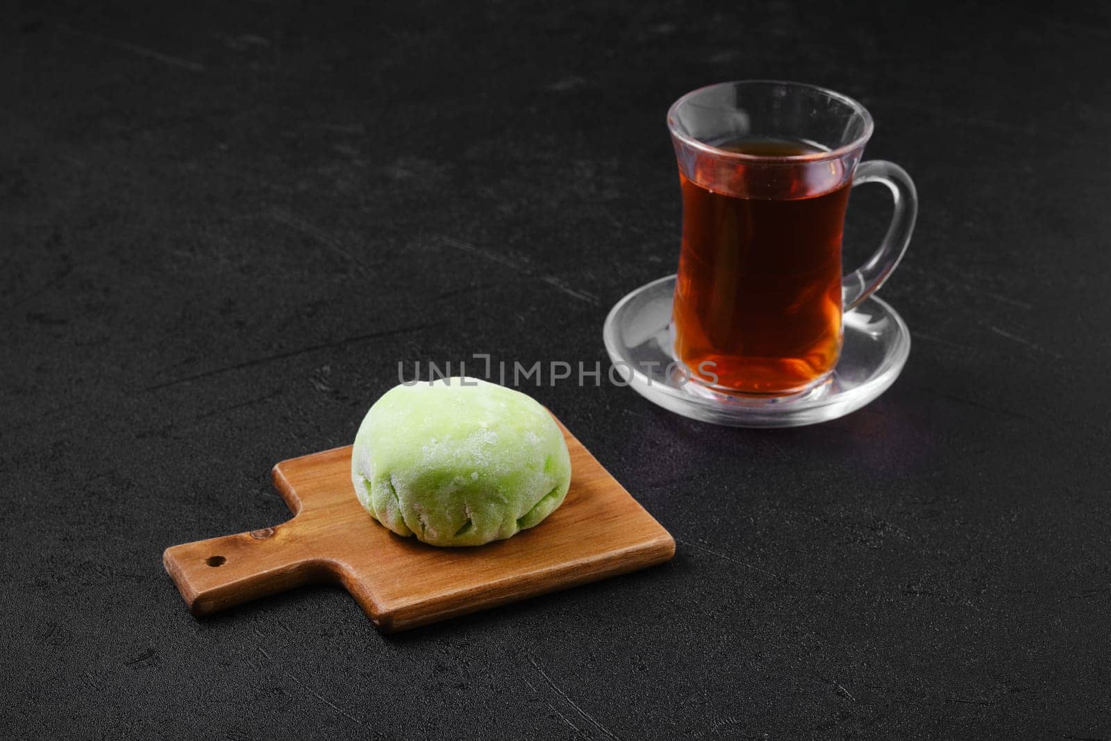 Sweet dessert mochi with kiwi with fruit tea