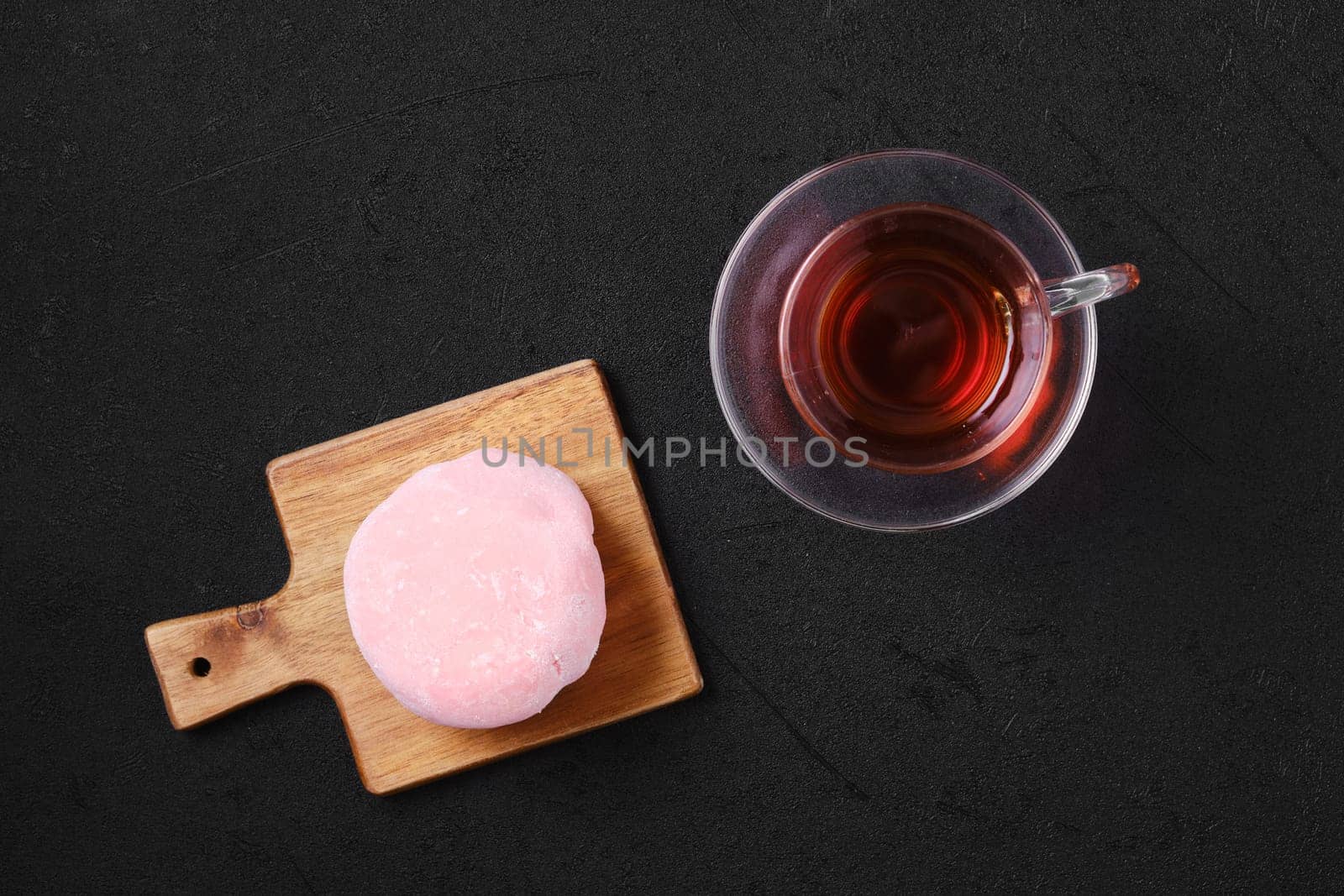 Top view of sweet dessert mochi with strawberry with fruit tea