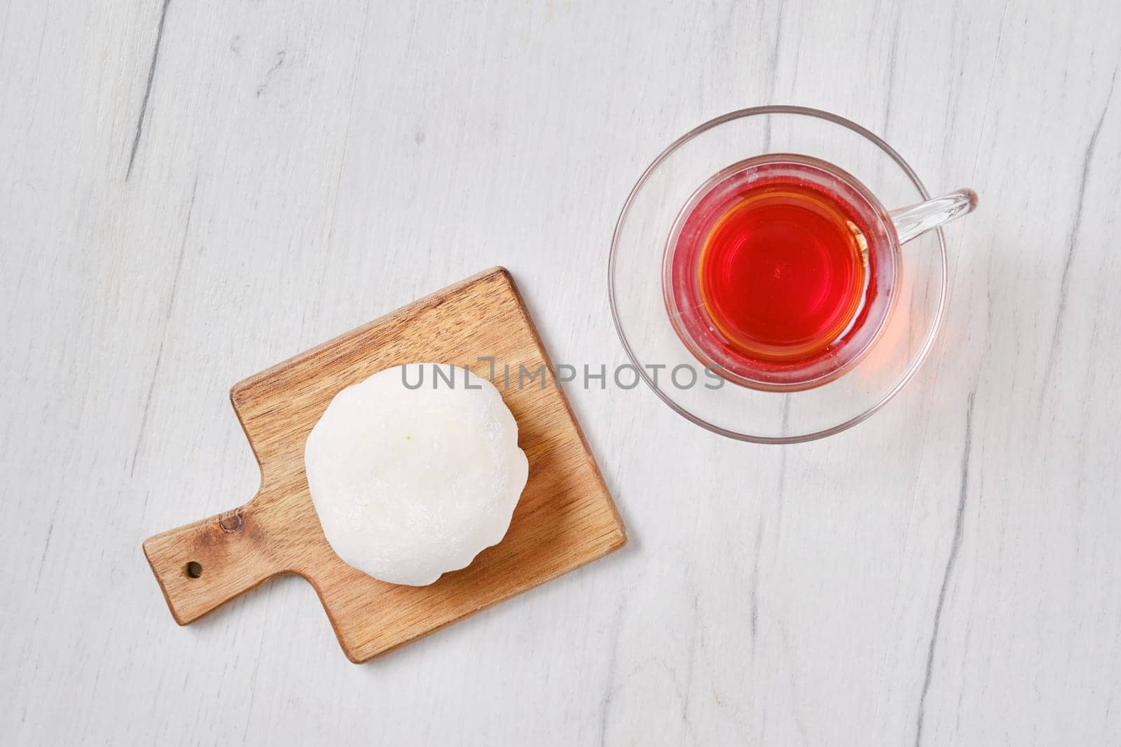 Top view of sweet dessert mochi with coconut chips with fruit tea