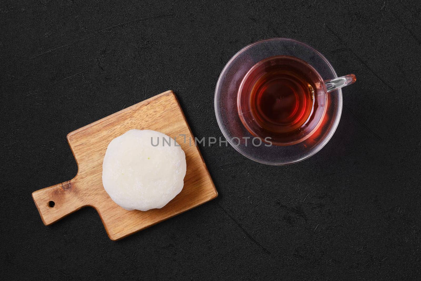 Top view of sweet dessert mochi with coconut chips with fruit tea