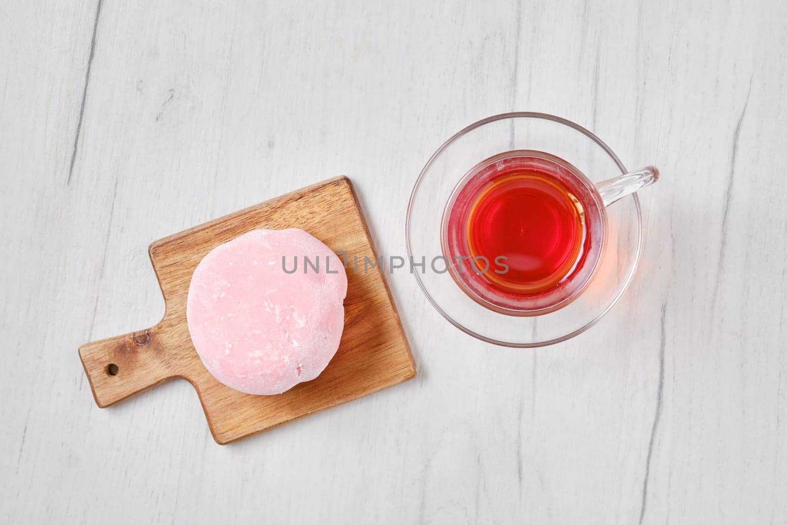 Top view of sweet dessert mochi with strawberry with fruit tea
