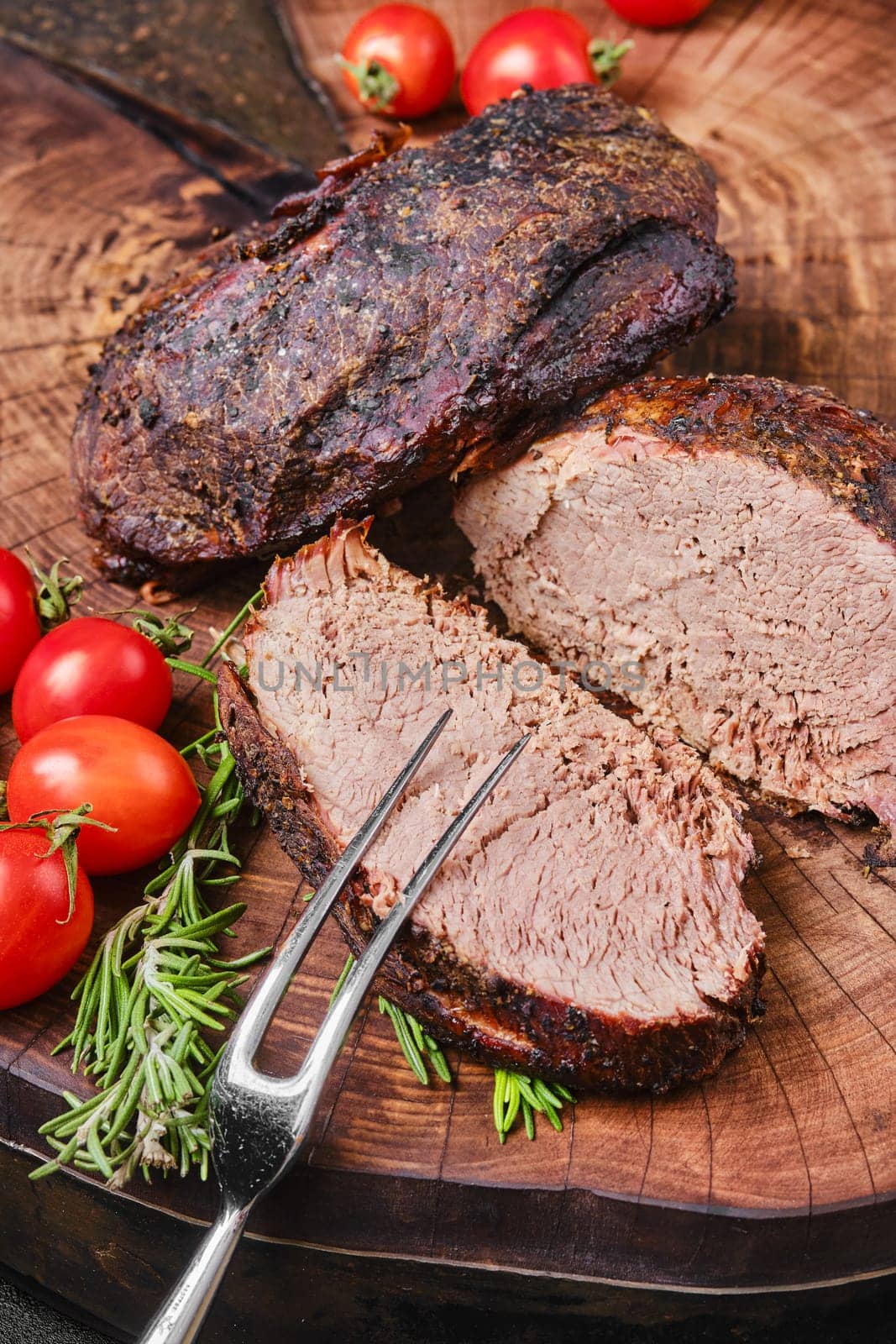 Slow cooking concept - baked beef top round meat, top view