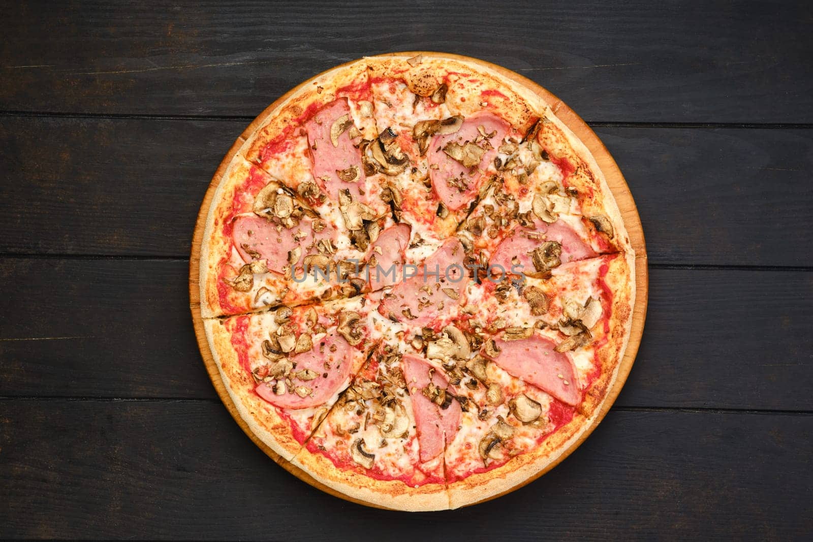 Pizza with beef ham, champignon mushrooms and tomato, top view
