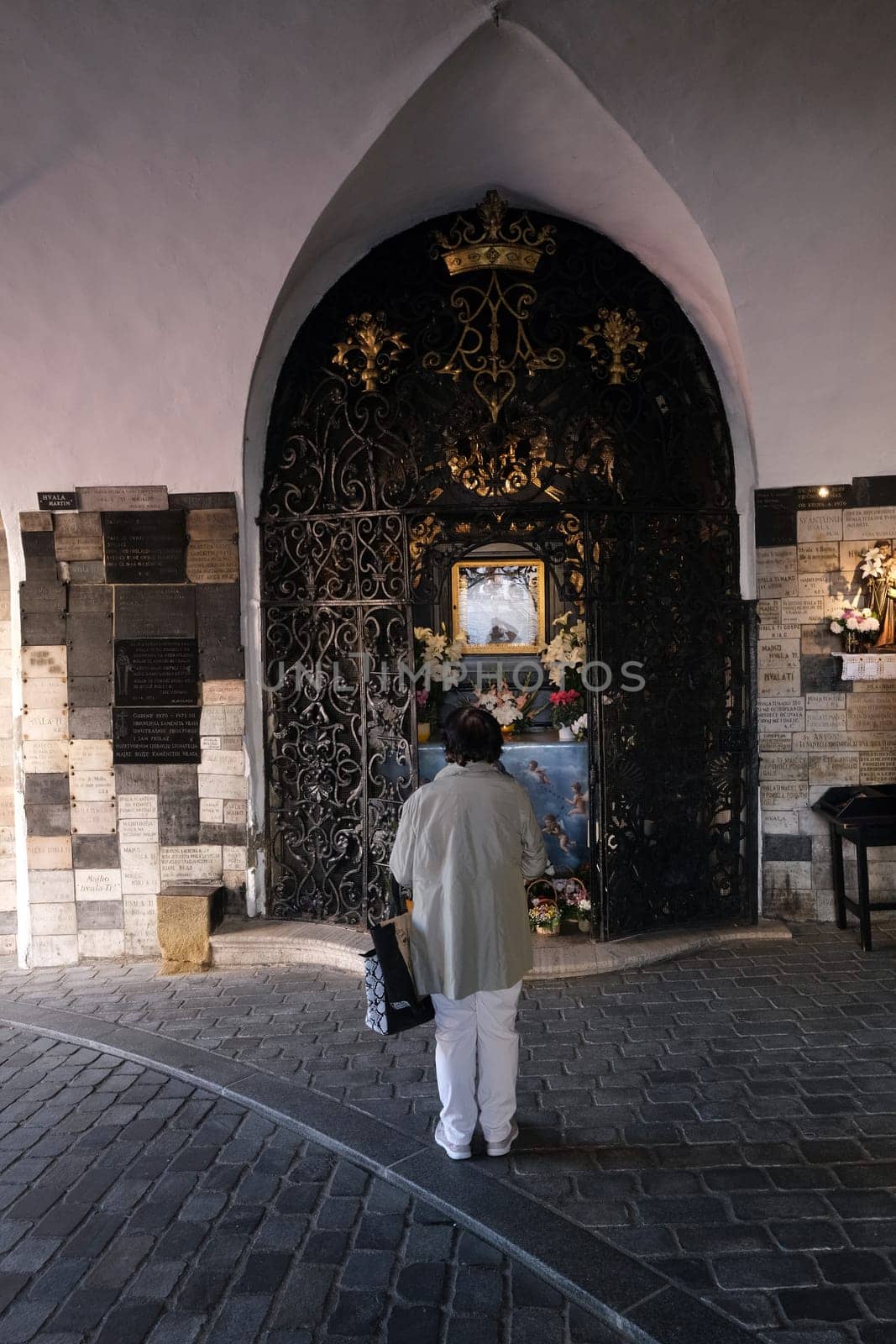 Faithful in prayer in the chapel of Our Lady of the Kamenita vrata (Stone Gate) in Zagreb, Croatia