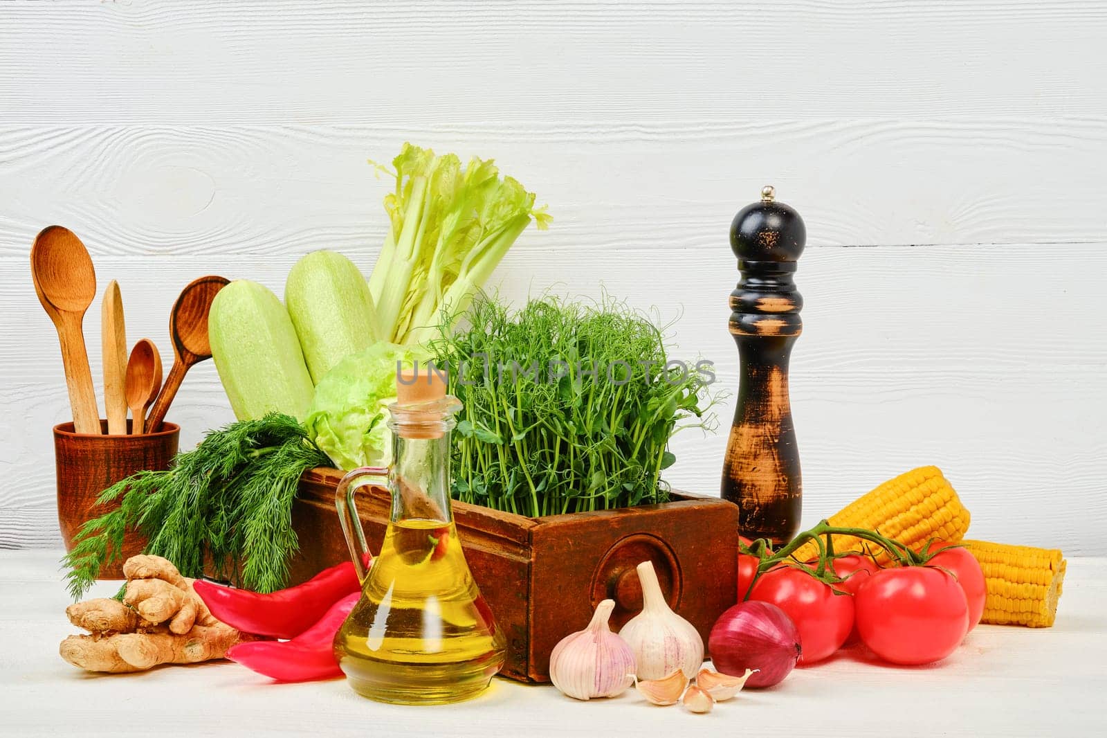 Wooden table with fresh eco vegetables and herbs. World vegan day concept with copy space for text.