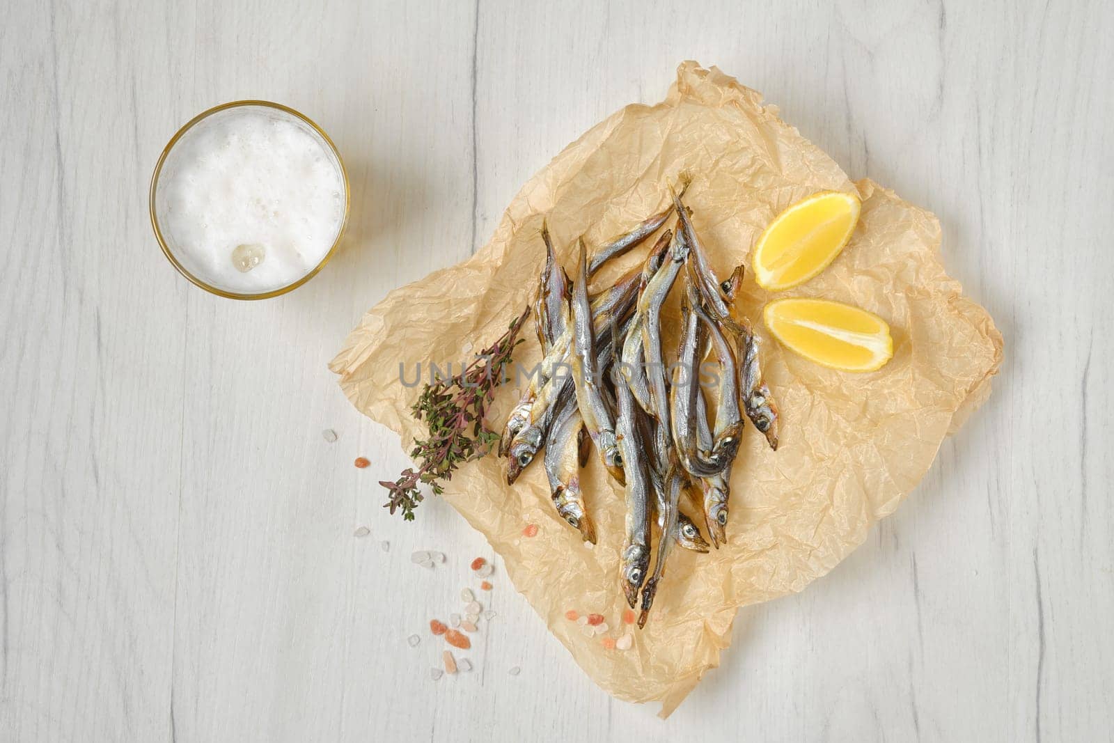 Top view of smoked smelt in wrapping paper
