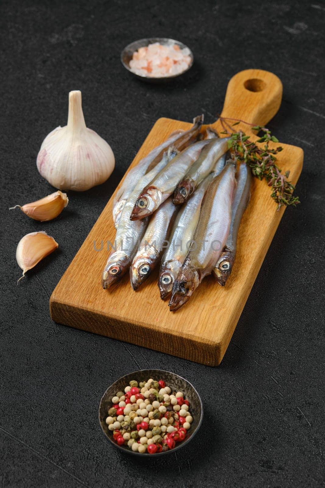 Pile of fresh raw frozen capelin