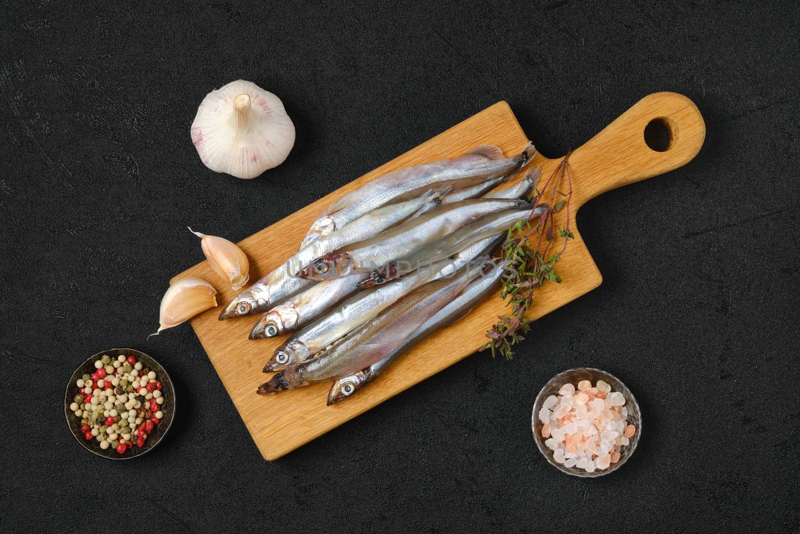 Top view of pile of fresh raw frozen capelin