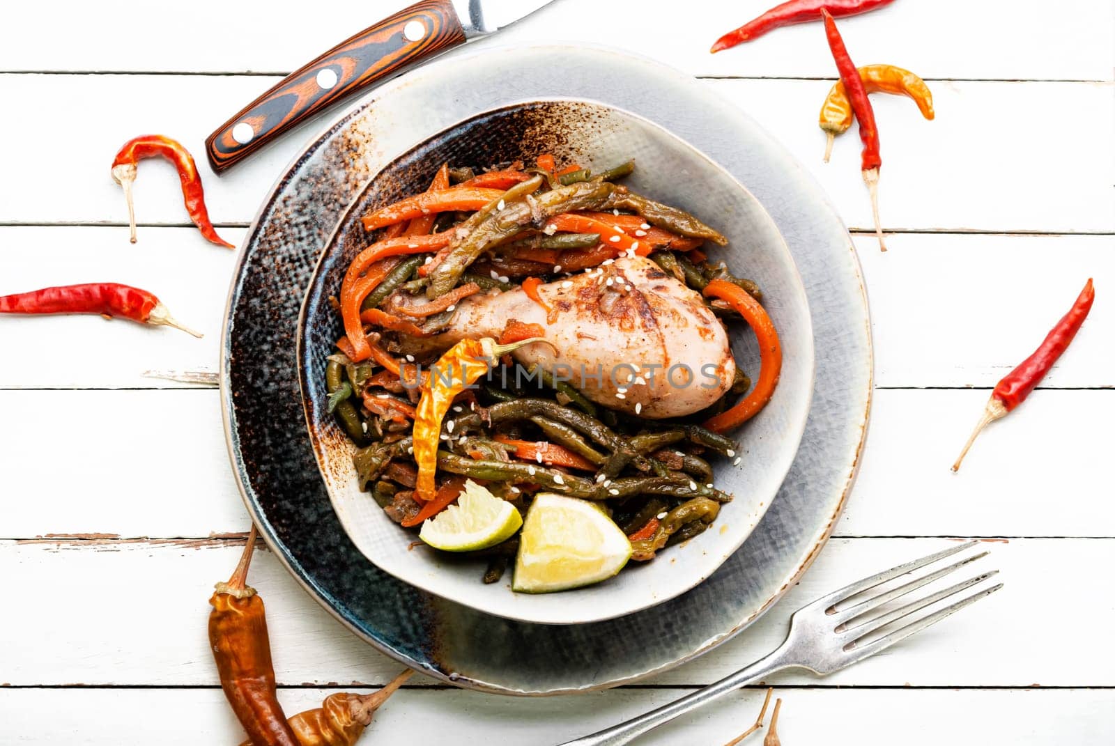 Delicious chicken legs stewed with asparagus beans and carrots.