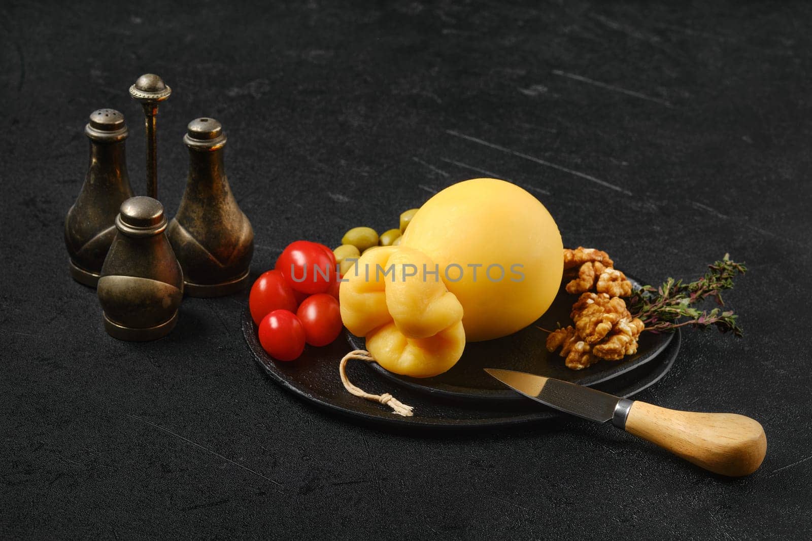 Delicious pulled caciocavallo yellow cheese on a plate