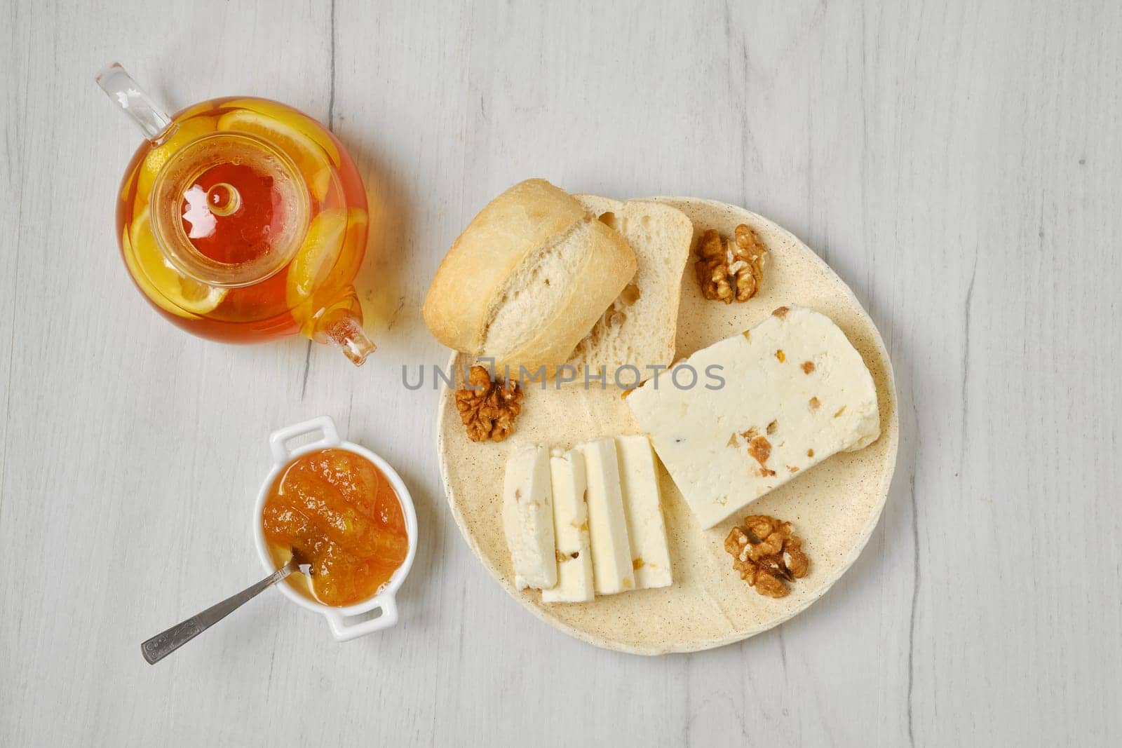 Healthy rustic breakfast. Top view of homemade curd cheese with raisin and walnut
