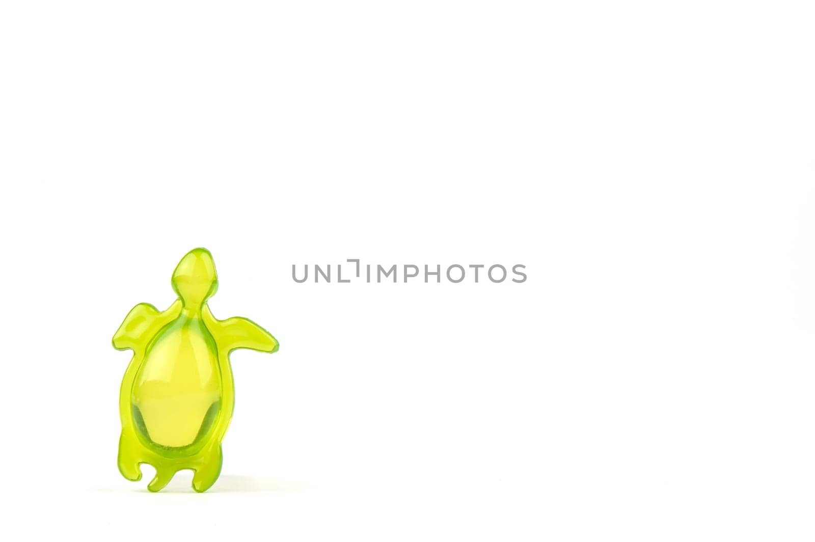 bath soap in the shape of a green tortoise, isolated on white background