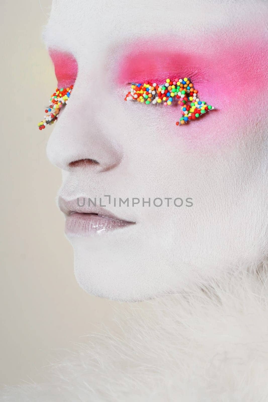 white model with candy on eyes