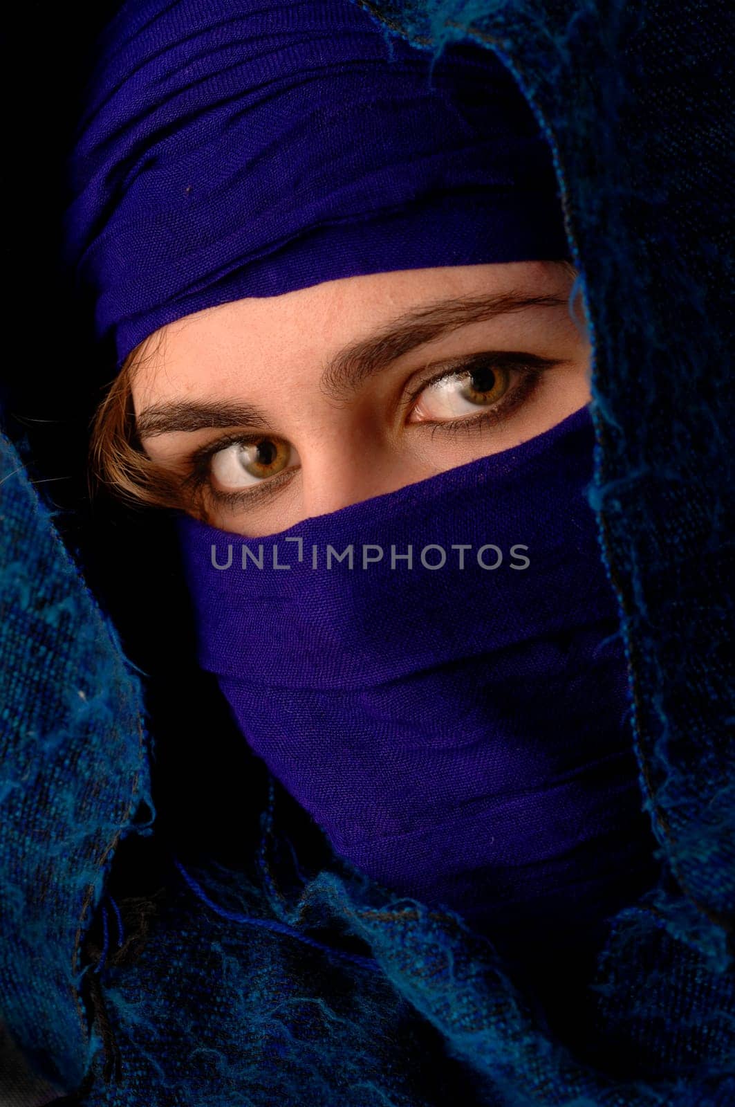 a beauty wrapped up in scarves