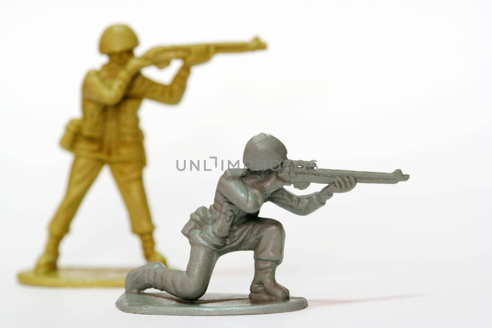 Toy soldiers firing their weapons.
