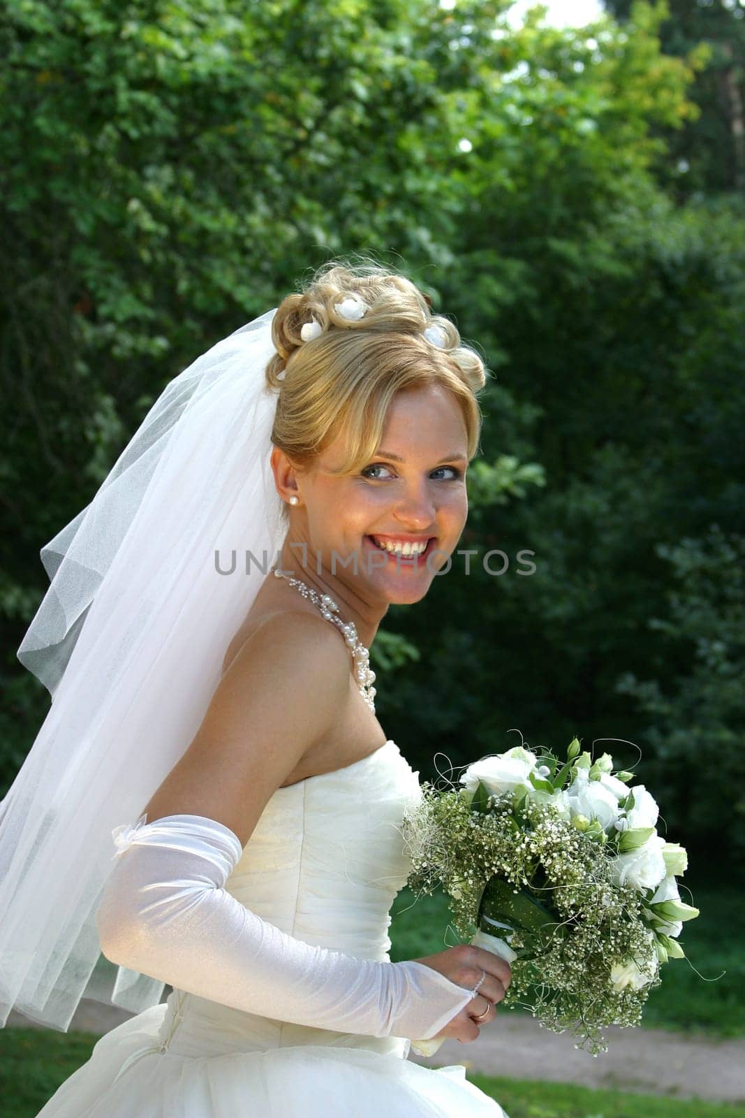 Beautiful smiles of the bride of the blonde. The happy Bride.