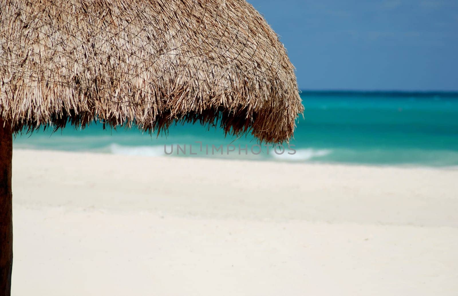 wicker umbrella on a beach
